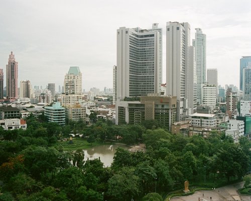 Calm walk through a city park in Bangkok with trees